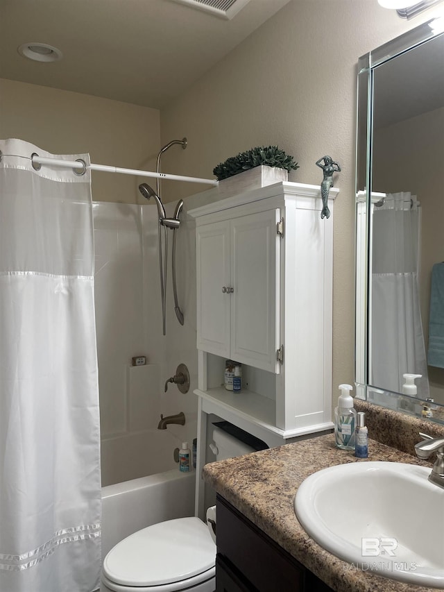 full bathroom featuring toilet, shower / bath combo, and vanity