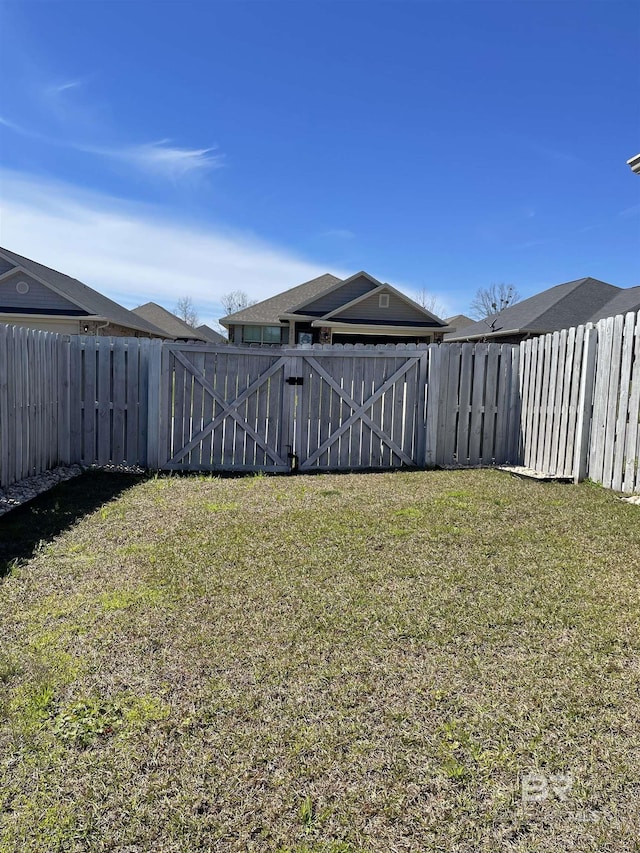 view of yard featuring a gate and fence