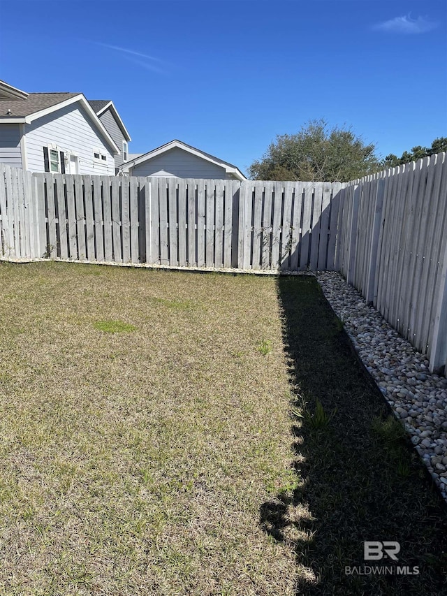 view of yard featuring a fenced backyard