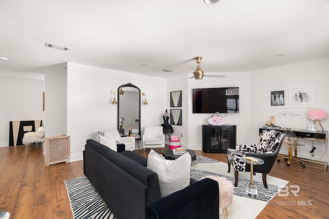 living room with hardwood / wood-style floors and ceiling fan