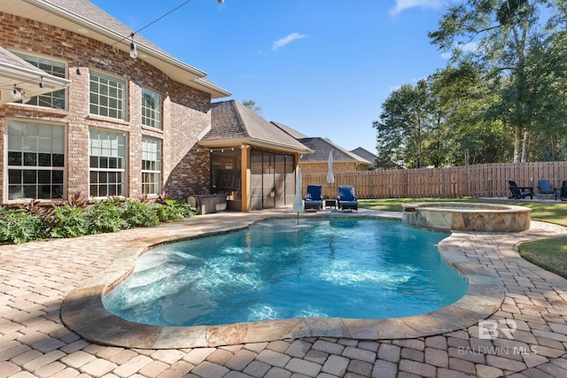 view of pool with an in ground hot tub and a patio