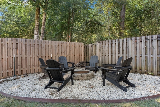 view of patio with an outdoor fire pit