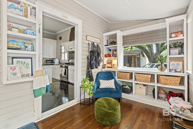 20 Hurlbert St, Mobile, AL 36607 - living area with crown molding, dark wood finished floors, and wooden walls