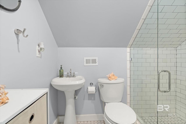 20 Hurlbert St, Mobile, AL 36607 - bathroom featuring vaulted ceiling, a shower stall, toilet, and baseboards