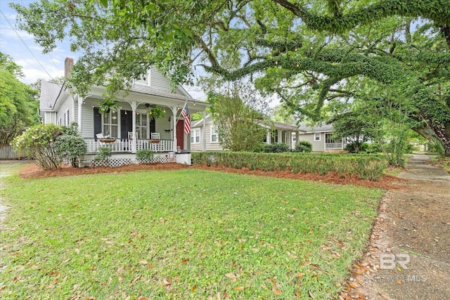 20 Hurlbert St, Mobile, AL 36607 - view of front of house featuring covered porch, a front lawn, and a chimney