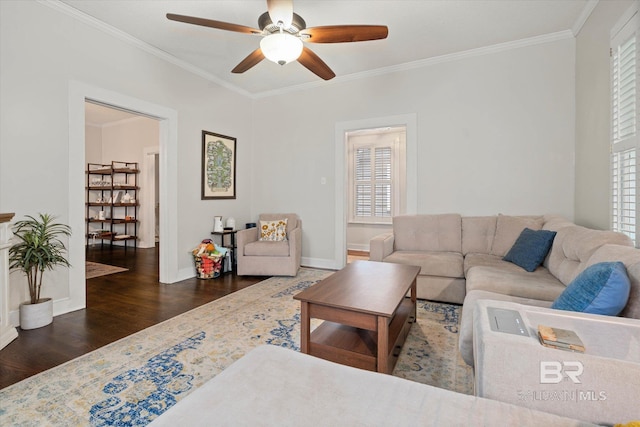 20 Hurlbert St, Mobile, AL 36607 - living area featuring wood finished floors, crown molding, ceiling fan, healthy amount of natural light, and baseboards