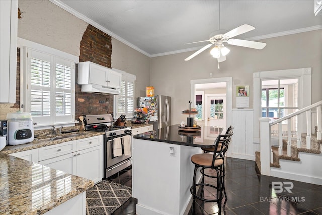 20 Hurlbert St, Mobile, AL 36607 - kitchen with appliances with stainless steel finishes, a sink, crown molding, ceiling fan, and white cabinets