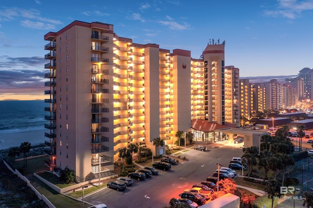 24400 Perdido Beach Blvd Unit 701, Orange Beach, AL 36561 - property at dusk with a water view and a view of city