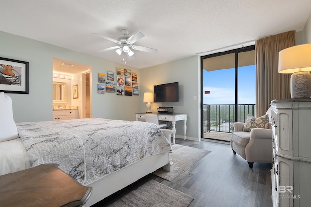 24400 Perdido Beach Blvd Unit 701, Orange Beach, AL 36561 - bedroom featuring ensuite bathroom, baseboards, a wall of windows, wood finished floors, and access to exterior