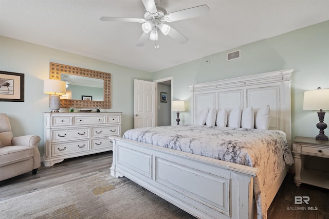 24400 Perdido Beach Blvd Unit 701, Orange Beach, AL 36561 - bedroom featuring visible vents, ceiling fan, and wood finished floors