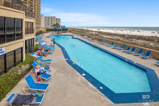 24400 Perdido Beach Blvd Unit 701, Orange Beach, AL 36561 - community pool with a view of the beach, a patio area, and a water view