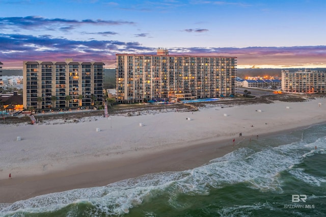 24400 Perdido Beach Blvd Unit 701, Orange Beach, AL 36561 - aerial view at dusk featuring a water view, a city view, and a view of the beach
