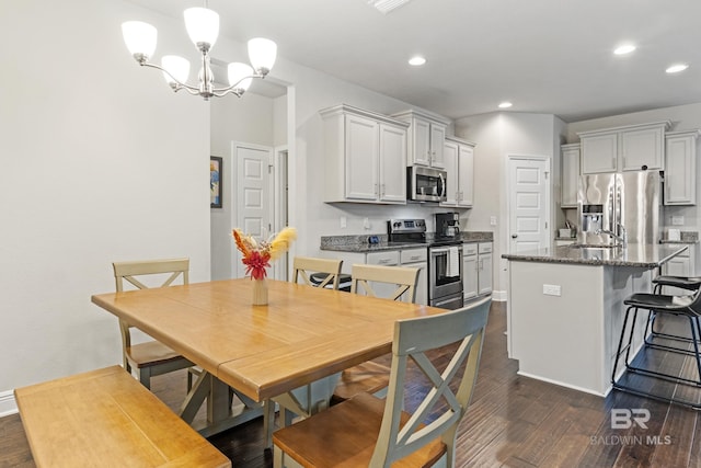 9393 Impala Dr, Foley, AL 36535 - dining room with recessed lighting, a notable chandelier, and dark wood-style flooring