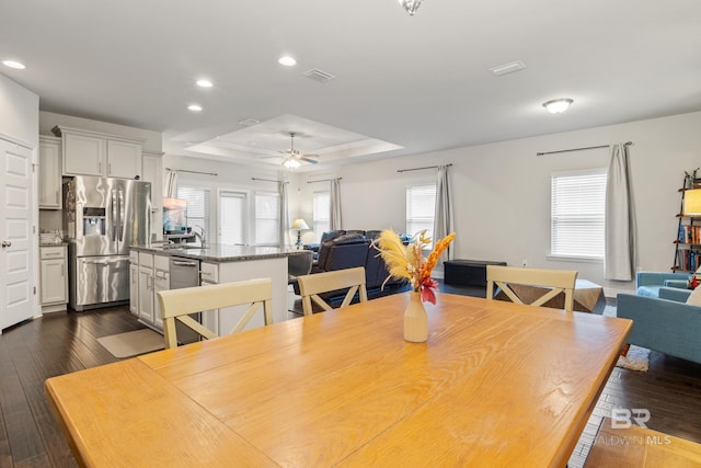 9393 Impala Dr, Foley, AL 36535 - dining room with visible vents, dark wood finished floors, recessed lighting, a raised ceiling, and a ceiling fan