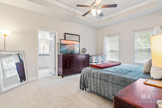 9393 Impala Dr, Foley, AL 36535 - bedroom with a ceiling fan, a tray ceiling, ornamental molding, ensuite bathroom, and carpet flooring