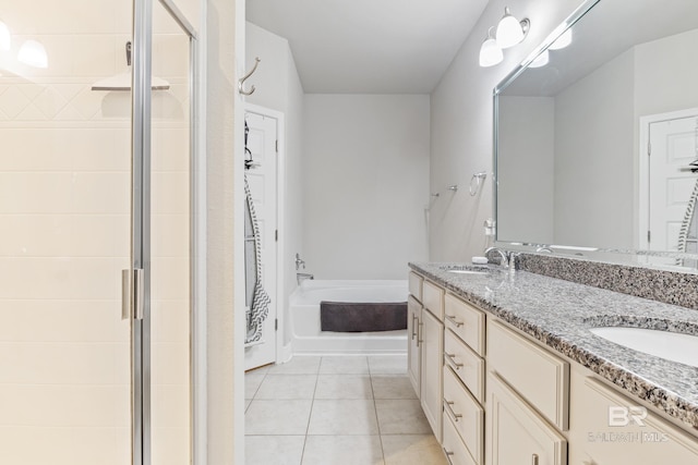 9393 Impala Dr, Foley, AL 36535 - bathroom featuring a sink, a garden tub, a stall shower, and tile patterned floors