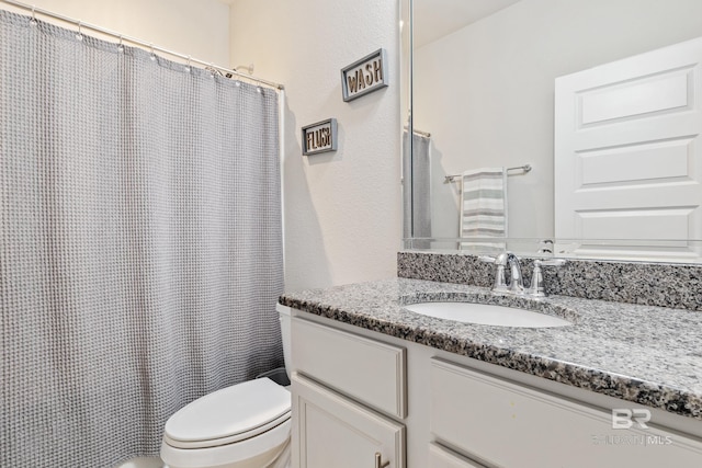 9393 Impala Dr, Foley, AL 36535 - bathroom featuring curtained shower, toilet, and vanity