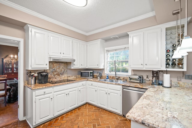 kitchen with white cabinets, a textured ceiling, ornamental molding, sink, and stainless steel appliances