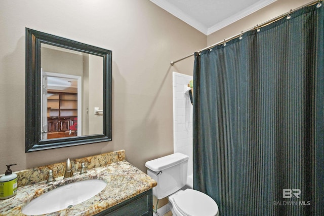 bathroom featuring vanity, toilet, ornamental molding, and a shower with shower curtain