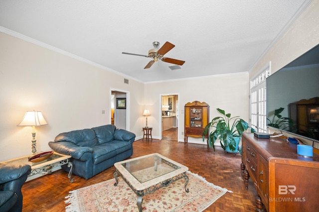 living room featuring ornamental molding, dark parquet floors, and a textured ceiling