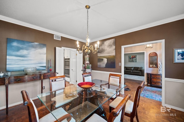 dining area with parquet flooring and ornamental molding