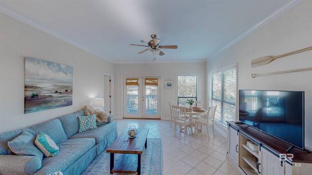 tiled living room with crown molding, french doors, and ceiling fan