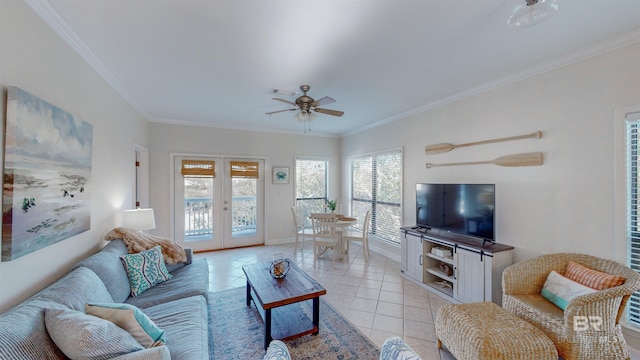 tiled living room featuring crown molding, ceiling fan, and french doors