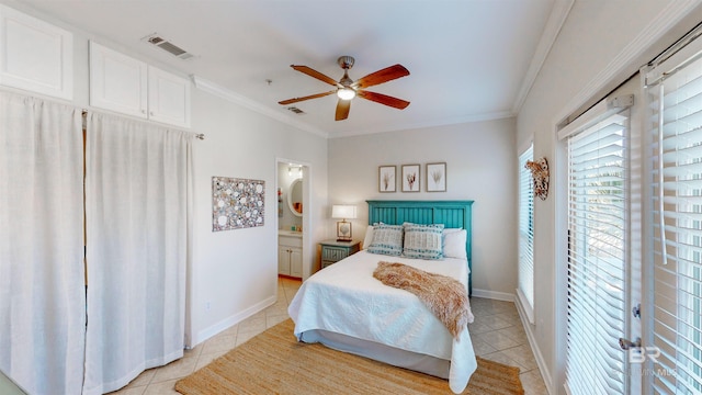 tiled bedroom with crown molding, ceiling fan, and ensuite bathroom