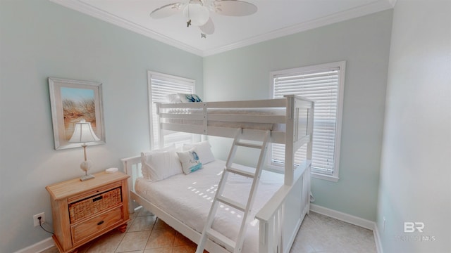 tiled bedroom featuring ornamental molding and ceiling fan