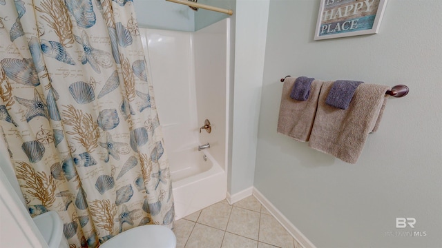 bathroom with tile patterned flooring and shower / tub combo