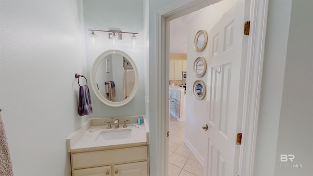 bathroom with tile patterned floors and vanity