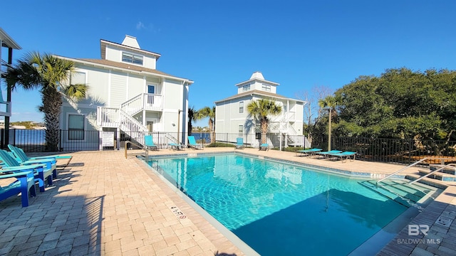 view of swimming pool featuring a patio area