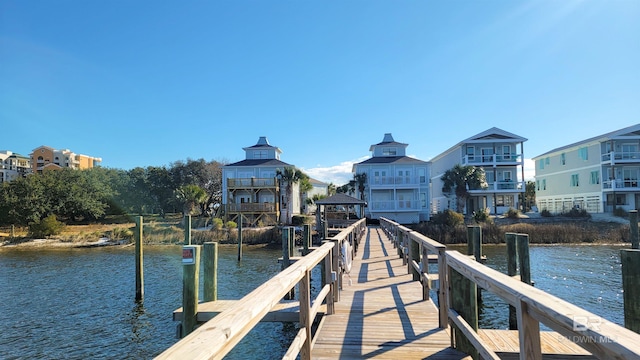 dock area featuring a gazebo and a water view