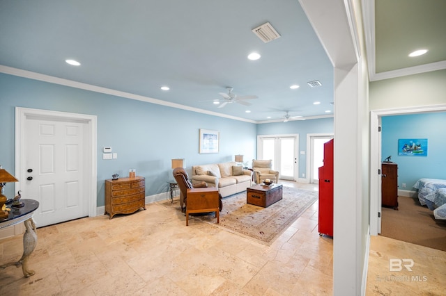 living room featuring ceiling fan and ornamental molding