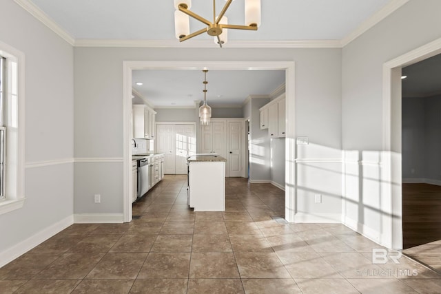 kitchen featuring stainless steel dishwasher, a kitchen island, white cabinetry, and crown molding