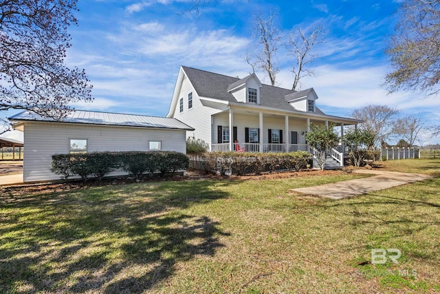 exterior space featuring a porch and a yard