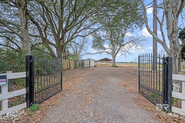 view of gate featuring fence