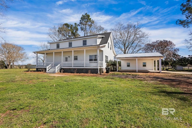 farmhouse-style home with covered porch and a front yard