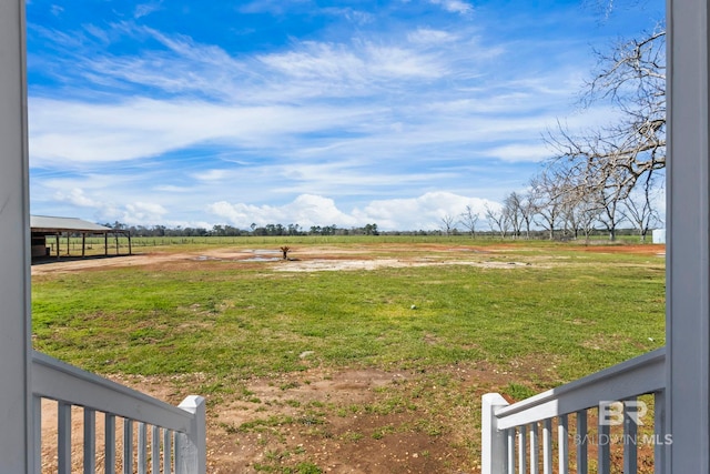 view of yard with a rural view