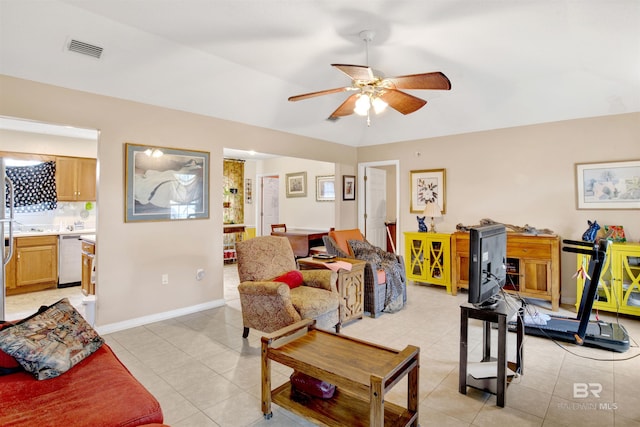 living room featuring light tile patterned flooring and ceiling fan