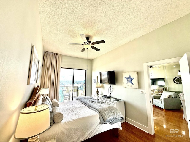 bedroom with a textured ceiling, ceiling fan, access to exterior, baseboards, and wood finished floors