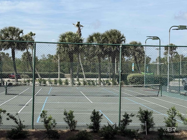 view of sport court with fence