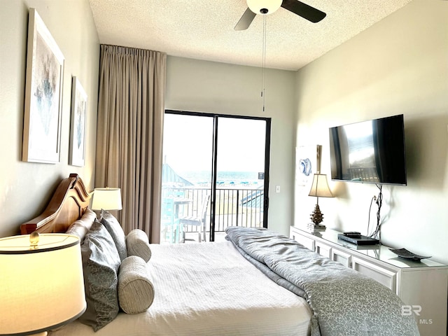bedroom featuring access to exterior, a ceiling fan, and a textured ceiling