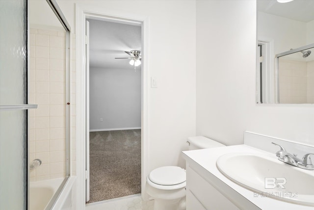 full bathroom featuring vanity, ceiling fan, shower / bath combination with glass door, and toilet