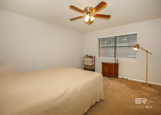 unfurnished bedroom featuring light carpet and ceiling fan