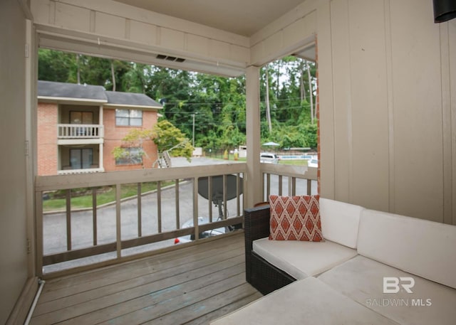 wooden deck with outdoor lounge area