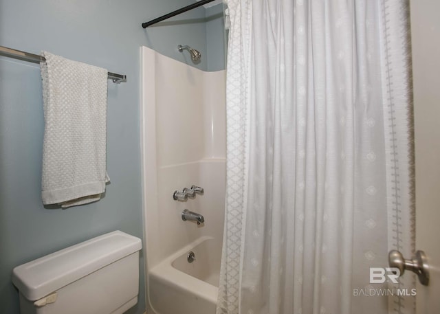 bathroom with shower / bath combo and toilet