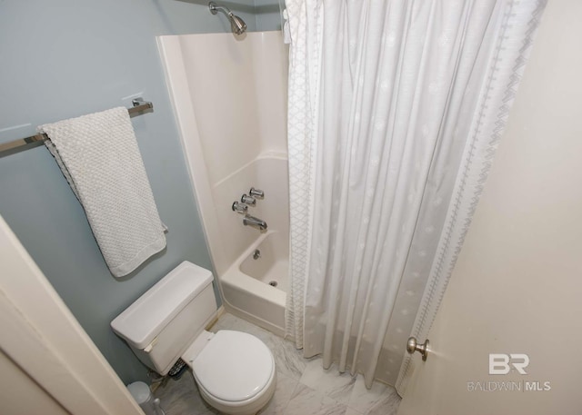 bathroom with shower / bath combo and toilet