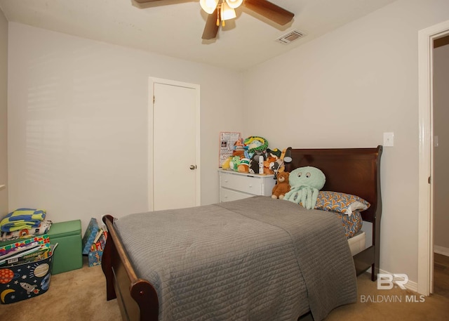 bedroom with light carpet and ceiling fan