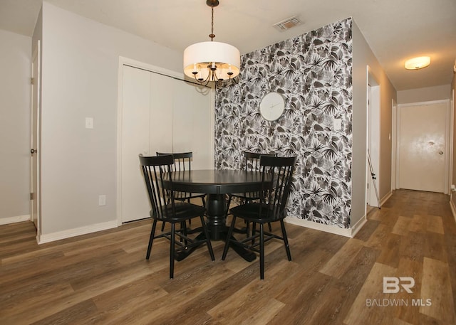 dining space with dark wood-type flooring